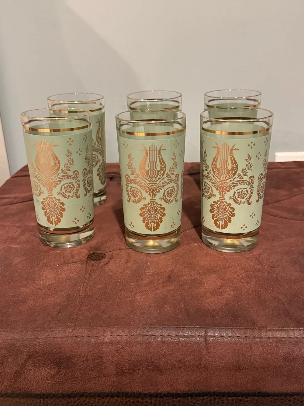 Set of 6 glasses vintage green and gold design. Holds 8 ounces